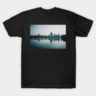 Film photo of Central Park, New York City, with its lake and surrounded buildings T-Shirt